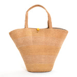 1950s plaited straw bucket hand bag purse with yellow latch button at top and horizontal variation of color of straw across bag
