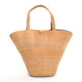 1950s plaited straw bucket hand bag purse with yellow latch button at top and horizontal variation of color of straw across bag