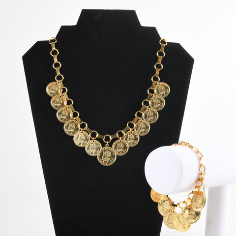 vintage mid 1960s through mid 1970s Panama VN Balboa Reproduction Gold Coin Necklace and Matching Bracelet Set Shown with Necklace on black Necklace display and right lower image bracelet hanging on white bracelet display all on white background
