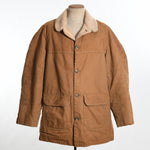 true vintage 1970s brown duck canvas faux shearling lined Carhartt work coat shown on dress form with white background