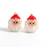 vintage 1980s red white Santa Face and hat plastic grid yarn handmade earring studs shown on white background