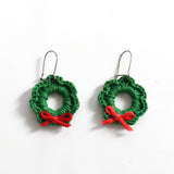 vintage 1980s green holiday wreaths red bow dangly hook latch earrings on white background