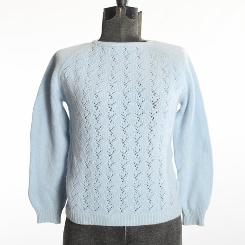 vintage 1960s soft blue long sleeve knit sweater shown on dress form with white background