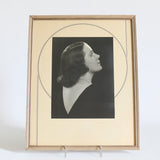 true vintage 1930s side angled silhouette woman portrait with cream art deco design matte with silver and black deco lines and natural wood narrow frame shown on white bacground