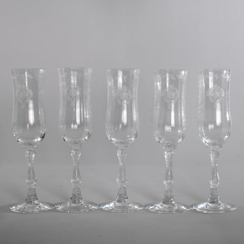 vintage 1980s set of 5 clear crystal fluted champagne glasses in navarre etched pattern  shown in line on gray background