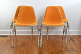 Vintage 1970s Orange Off White Fiberglass Eames DSS Stacking Side Chairs Set of 4 | by Herman Miller