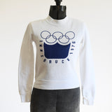 true vintage 1970s white Innsbruck 1976 Olympics sweatshirt shown on dress form on white background