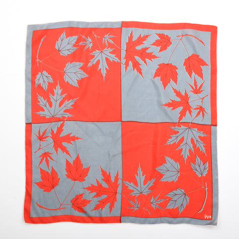 true vintage silvery gray and orange red color block maple leaf silk scarf with name vera in lower right corner lying flat on white background