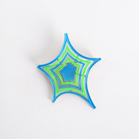 true vintage 1960s bright blue bright neon green spider web enamel brooch shown on white background