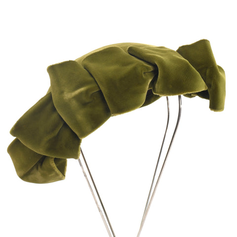 true vintage 1940s chartreuse green velvet face framing bow loops short crown angled tilt hat shown on thin silver metal  leg hat stand all on white background