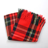 vintage 1950s thin red wool plaid blanket folded in a square angled with fringe pointing towards top on white background