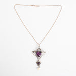 antique 1900s purple glass double pendant lavalier necklace shown lying flat on white background