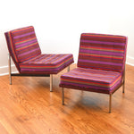 true vintage 1960s purple red orange striped steel frame parallel bar chairs set of 2 by florence Knoll shown with one angled toward right behind other which is angled slightly to left on warm hardwood floor and white wall background