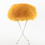 true vintage 60s yellow mod shearling hat shown on thin 4 leg silver metal black tip hat stand on white background