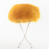 true vintage 60s yellow mod shearling hat shown on thin 4 leg silver metal black tip hat stand on white background