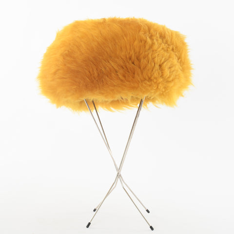 true vintage 60s yellow mod shearling hat shown on thin 4 leg silver metal black tip hat stand on white background