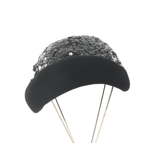 true vintage 1950s black felted wool black sequin face framing rolled brim cocktail hat shown on 4 leg silver metal at stand against white background