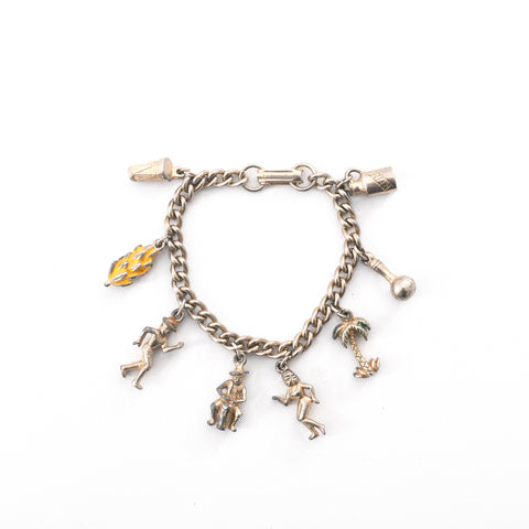 true vintage 1950s cuban dancing rum souvenir silver metal charm bracelet lying flat on white background