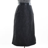 true vintage 1950s black fan pattern lace midi pencil skirt shown on dress form against white background