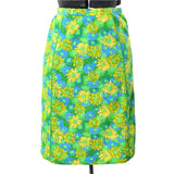 true vintage 1970s green blue yellow floral knee length Lilly skirt shown on dress form against white background