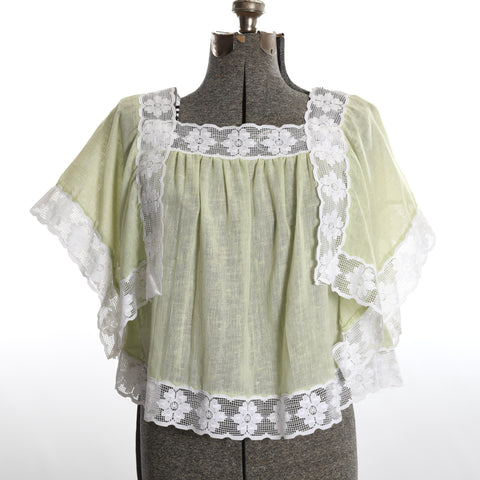 vintage 1970s green cotton muslin daisy lace trim handkerchief shirt shown on dress form with white background