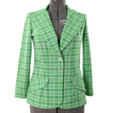 true vintage 1970s green white plaid 2 button peaked wide lapel womens suit jacket shown on dress image against white background