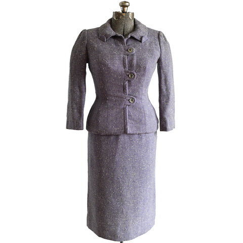 true vintage 50s purple skirt suit shown on dress form against white background