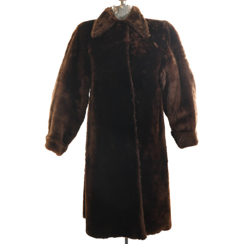 true vintage 1940s brown midi mouton coat with spearpoint collar and large barrel sleeves shown on dress form against white background