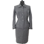 true vintage 1950s gray blue wasp waist skirt suit with 4 jacket pockets on dress form shown against white background