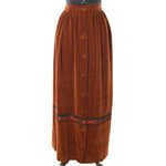 true vintage 1970s burnt orange gathered waist maxi skirt with button front and trim near bottom hem featuring a big cat chasing an antelope with palm trees in black with orange and brown shown on dress form against white background