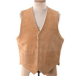 true vintage 1970s beige natural suede color center snap button vest lined in faux shearling with two front patch pockets shown on dress form against white background