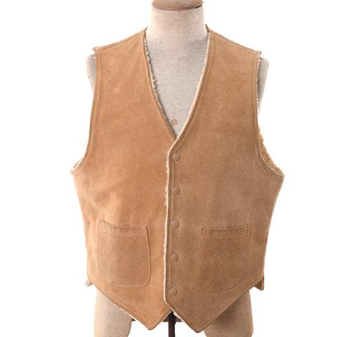 true vintage 1970s beige natural suede color center snap button vest lined in faux shearling with two front patch pockets shown on dress form against white background