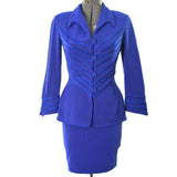 true vintage 90s royal blue mini long sleeve skirt suit with angled satin trim on jacket and bat wing shaped tip collar shown on dress form against white background