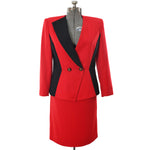 true vintage 1990s red black contrasting double breasted power skirt suit with black right lapel and black side panels shown on dress form against white background