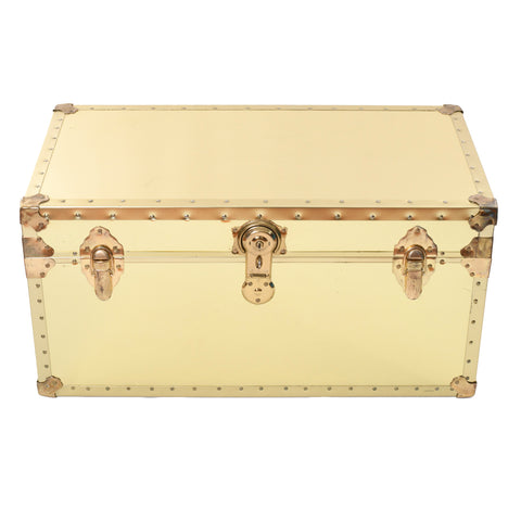 1980s vintage brass rectangular storage trunk with latch closures and center lock against white background