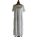 antique white chemise with upper bodice crocheted yoke featuring a bow design and flowers shown on dress form against white background