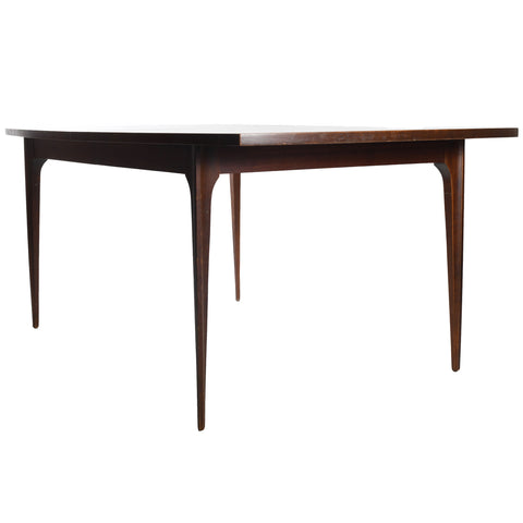 vintage 1960s broyhill brasilia rectangular brown wood table shown standing at an angle on white background