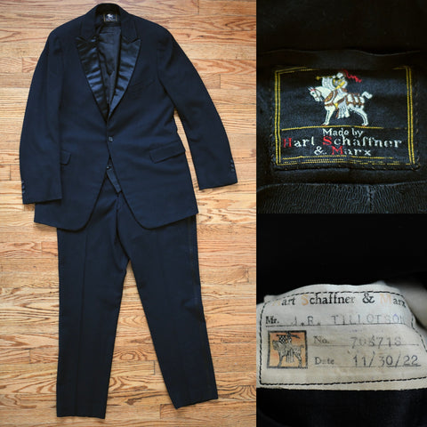 antique 1920s black 3 piece tuxedo with peaked satin lapels, one button jacket and satin stripe trousers with brocade vest shown lying flat on light warm hardwood floor left image with brand tag upper right image and make and date label lower right image 
