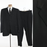 vintage 1950s black green zig zag single breasted 3 button suit shown on dress form with white shirt and tie left image along with hanging trousers middle image and close up of fabric right image all on white background