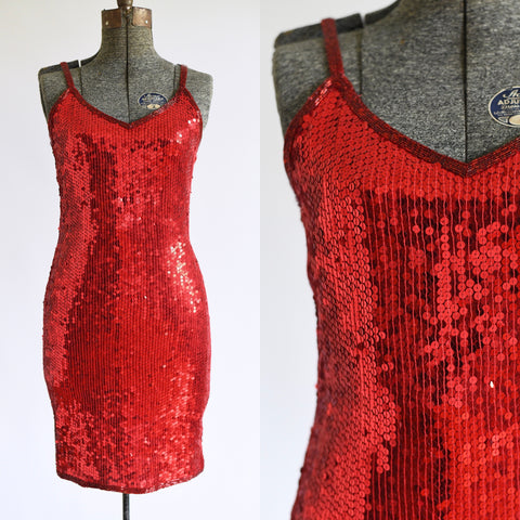 vintage late 80s up to mid 90s sleeveless short red sequin cocktail dress shown on dress form left image and close up of V shaped bodice right image all on white background