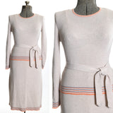 vintage 1970s light beige knit sweater matching skirt set orange and blue trim with original sweater belt tied on side shown on dress form left image with close up of bodice right image all on white background