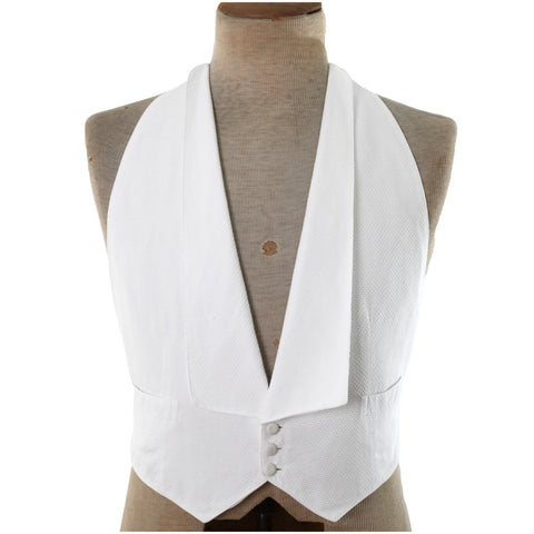 1920s white pique cotton formal backless 3 button closure waistcoat shown on dress form with white background