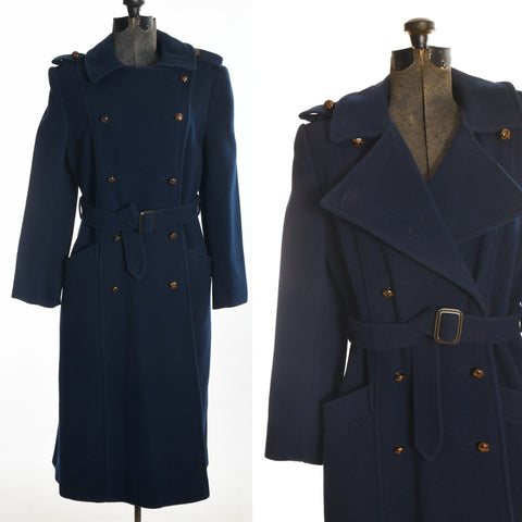 true vintage 1970s navy blue double breasted princess cut coat with matching belt shown on dress form left image and close up of bodice detail right image all on white background