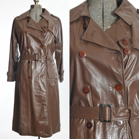 vintage late 70s early 80s milk chocolate brown leather midi double breasted trench coat with original belt shown on dress form left image with close up of bodice details right image all on white background