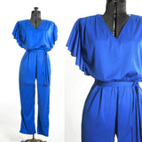 vintage 1980s true blue flutter sleeve jumpsuit with V neck shown on dress form left image with close up of bodice right side on white background