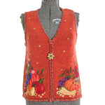 true vintage 1990s orange knit sweater harvest theme vest with crewel work and felted flowers, vegetables and fruits at bottom section of sweater vest shown on dress form on white background