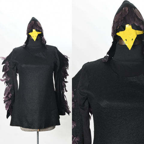 black bird halloween dress tunic with black turtleneck shirt and yellow beak black feathered head piece shown on dress form left image with close up of bodice and headpiece right image white background