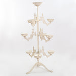 genuine antique cast metal cream plant stand with 9 moveable arms and top center holder shown on white background