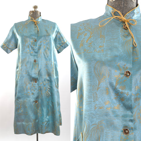 vintage 1950s soft blue satin acetate with metallic gold print all over short sleeve duster jacket shown on dress form left image with close up of novelty print Persian man on horse in garden right image all on white background