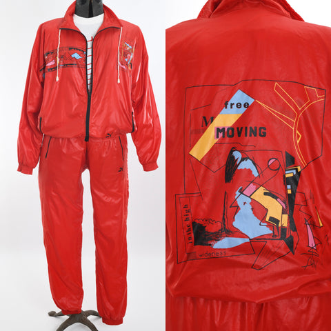vintage 1990s 3 piece red ski graphic wind breaker pants suit shown on dress form with close up of back graphic right image all on white background